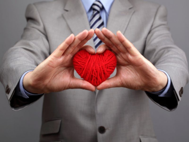 Man holding crochet heart